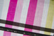 Striped rainbow swatches blending pink and yellow hues, showcasing a vibrant spectrum of tones and gradients.